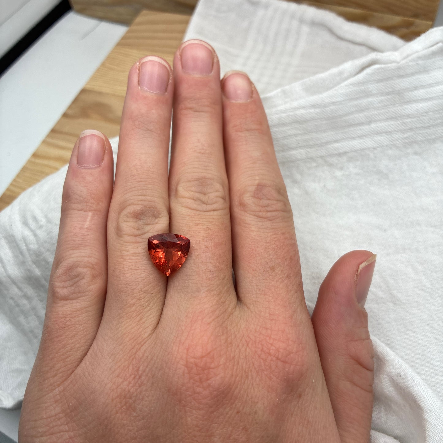 3.87 carat Orange Oregon Sunstone 10.75mm Trillion Cut