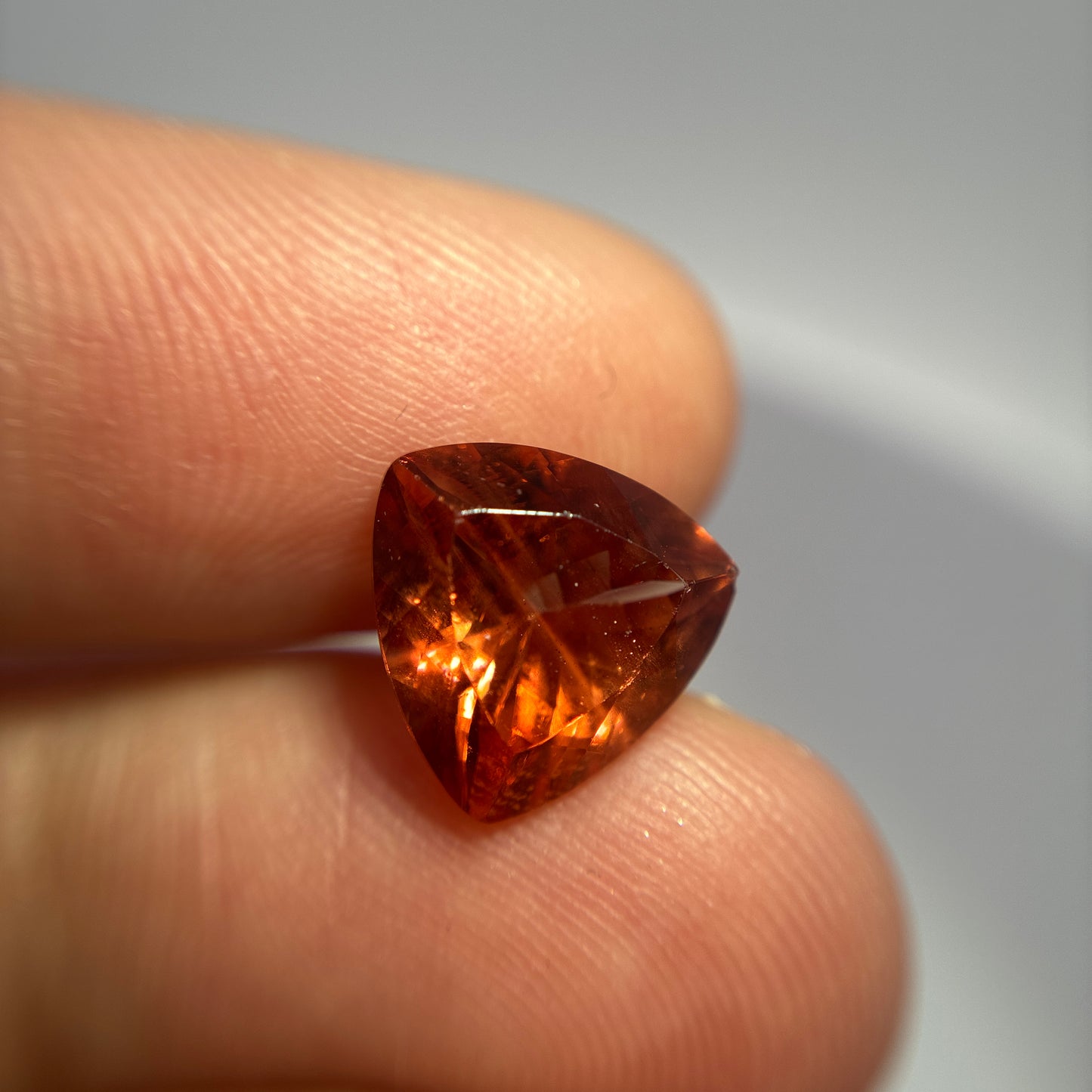3.87 carat Orange Oregon Sunstone 10.75mm Trillion Cut
