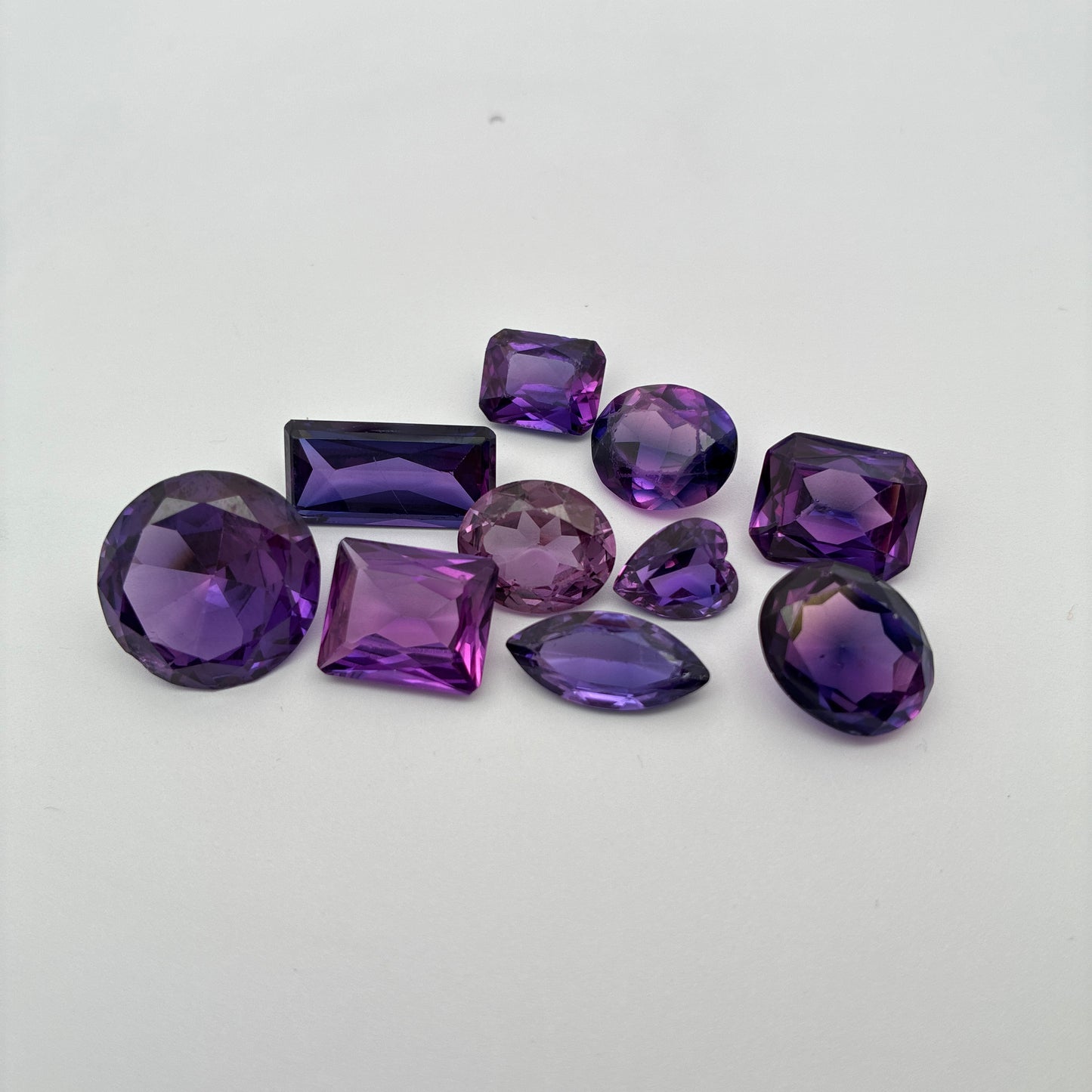 62.9 carat Lot of Lab Created Purple Sapphires , Worn, Faceted, Recycled, Chipped, Damaged Gemstones, 10 Stones