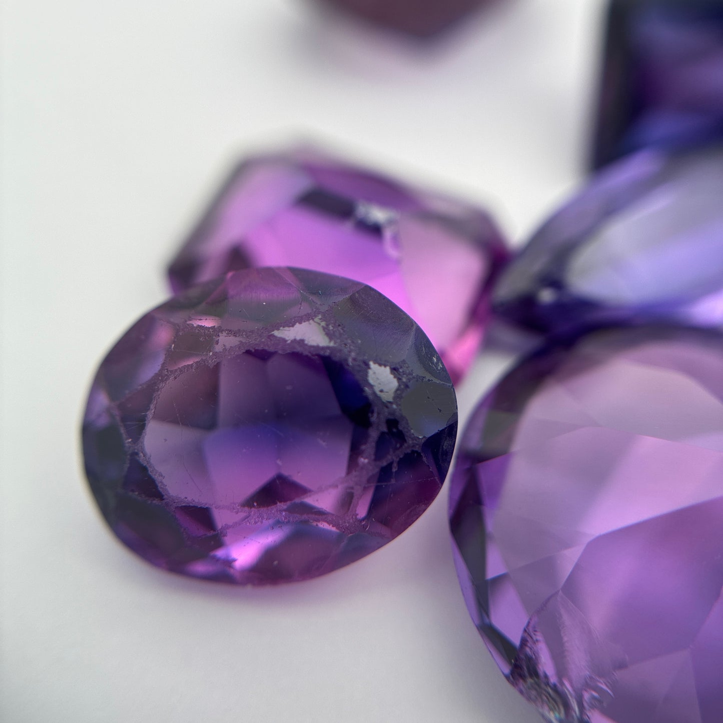 62.9 carat Lot of Lab Created Purple Sapphires , Worn, Faceted, Recycled, Chipped, Damaged Gemstones, 10 Stones