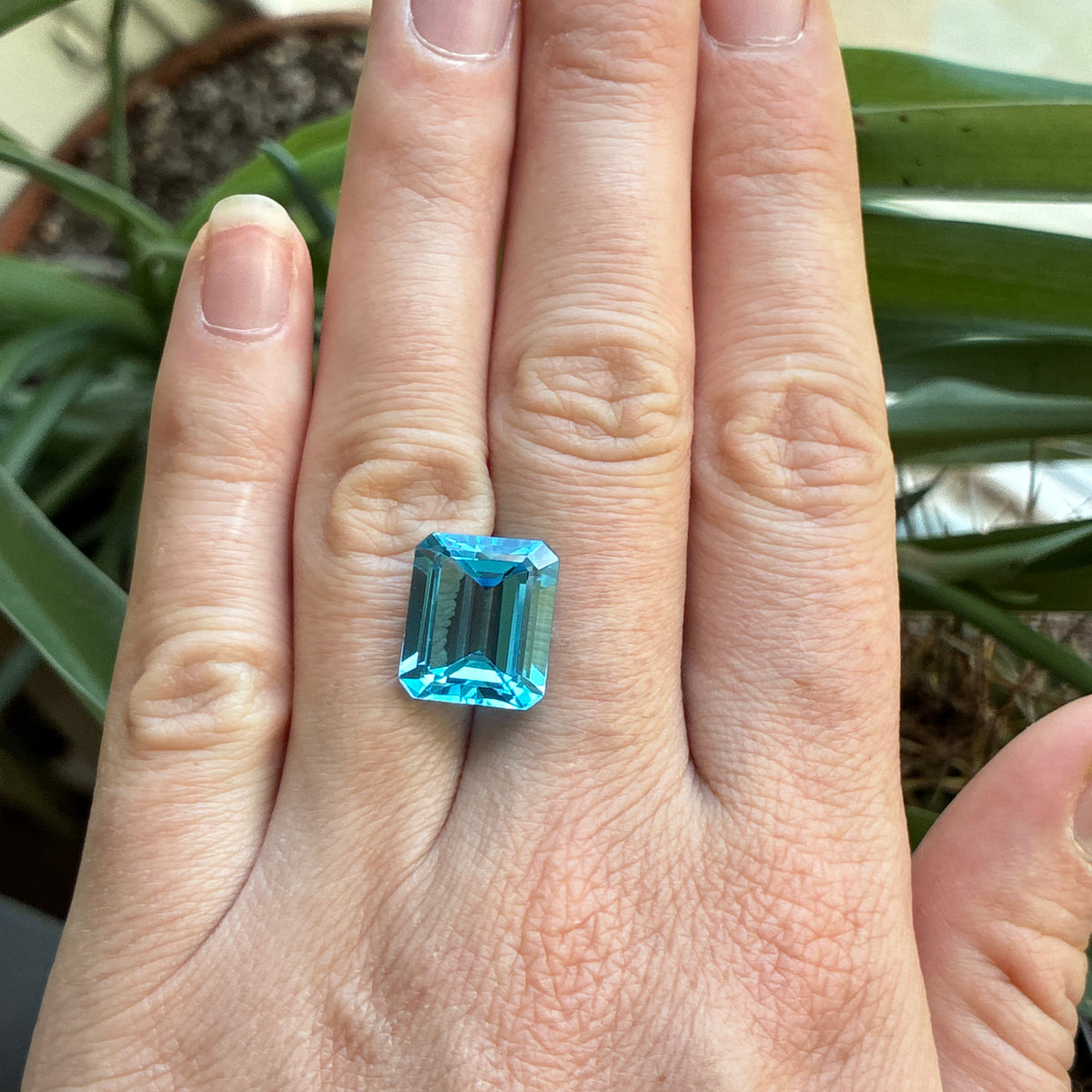 11.38 carat Emerald Cut Loose Blue Topaz