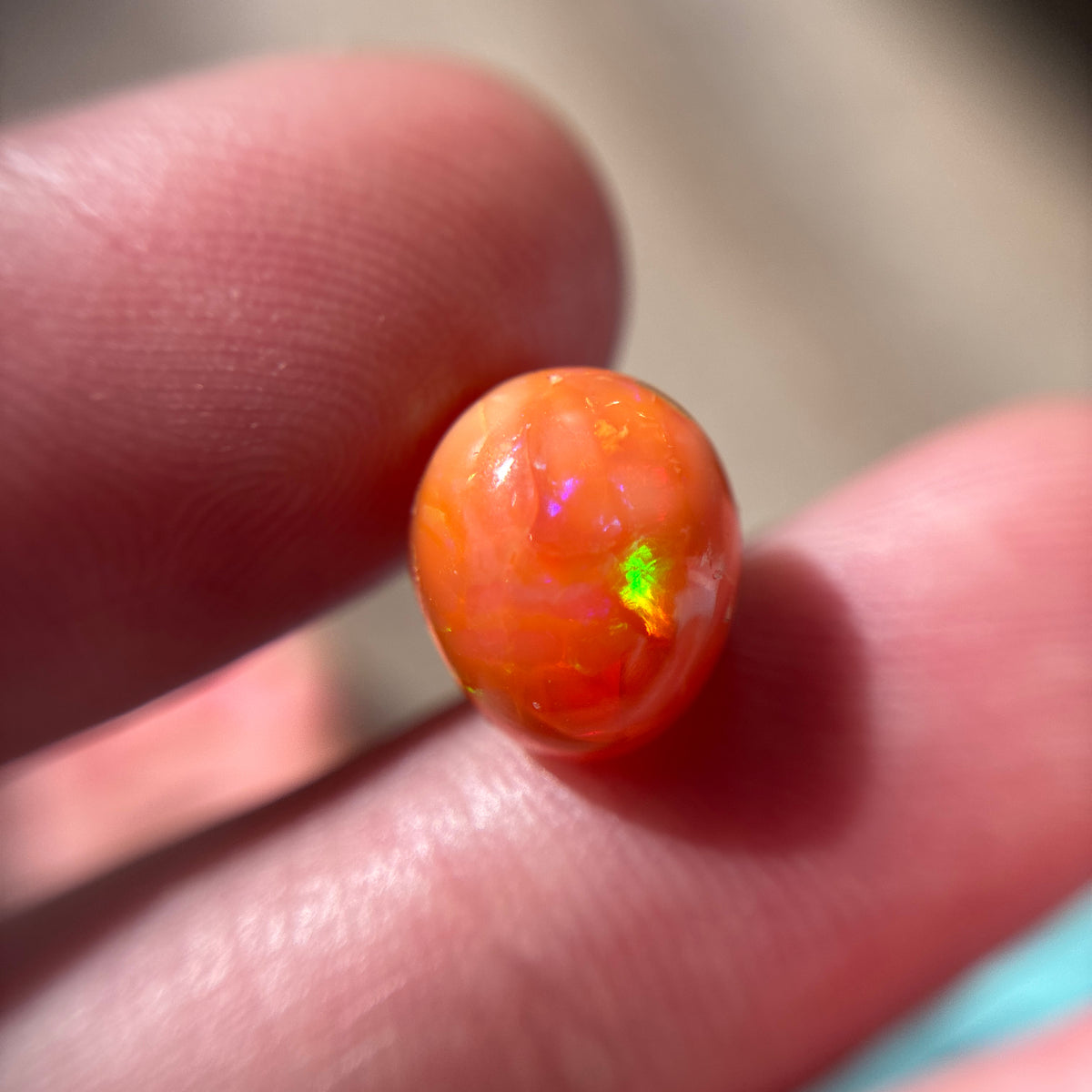 3.16 carat Orange Opal 10.8x9.2mm Oval Cabochon