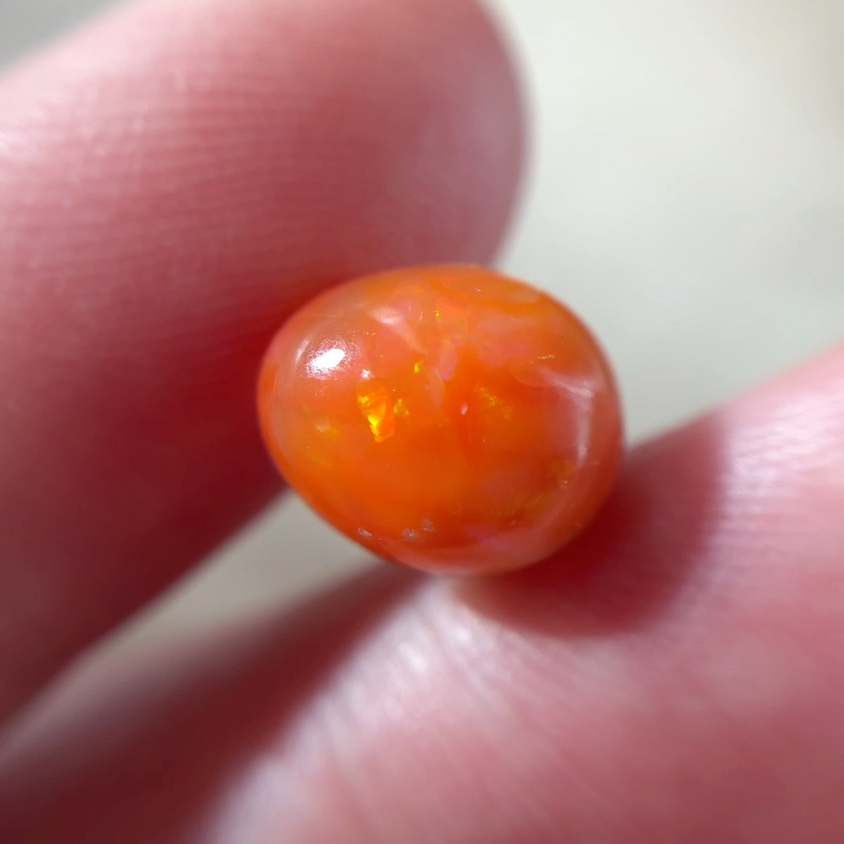 3.16 carat Orange Opal 10.8x9.2mm Oval Cabochon