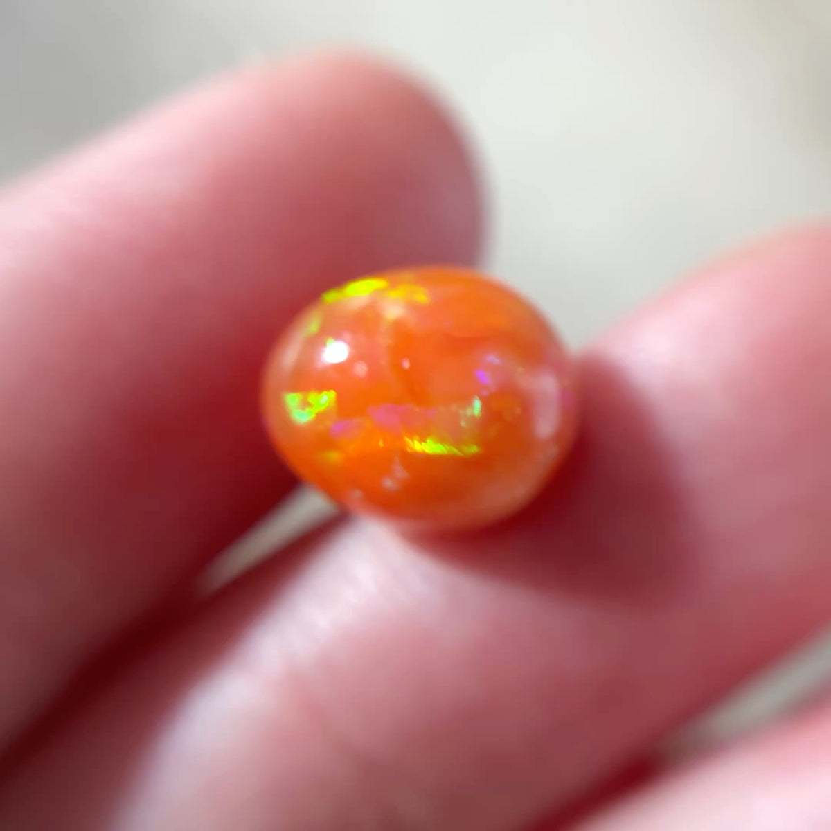 3.16 carat Orange Opal 10.8x9.2mm Oval Cabochon