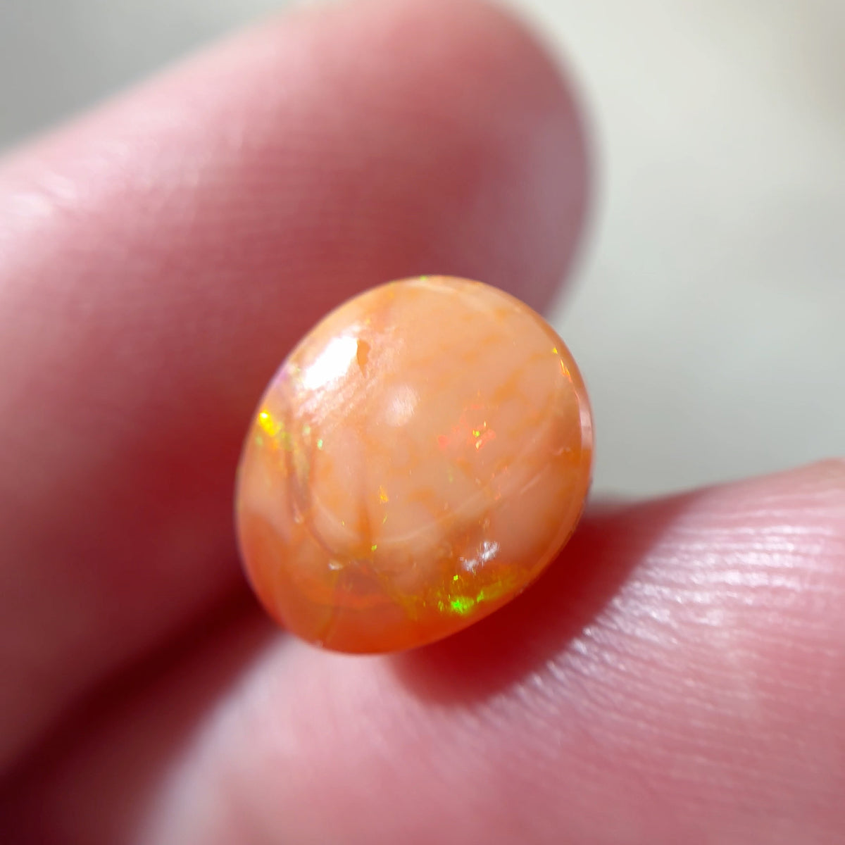 3.16 carat Orange Opal 10.8x9.2mm Oval Cabochon