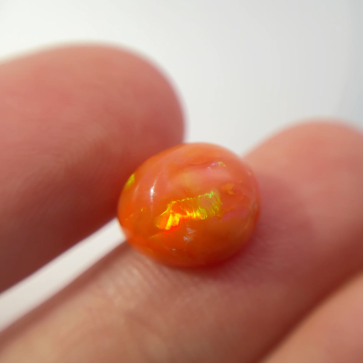3.16 carat Orange Opal 10.8x9.2mm Oval Cabochon