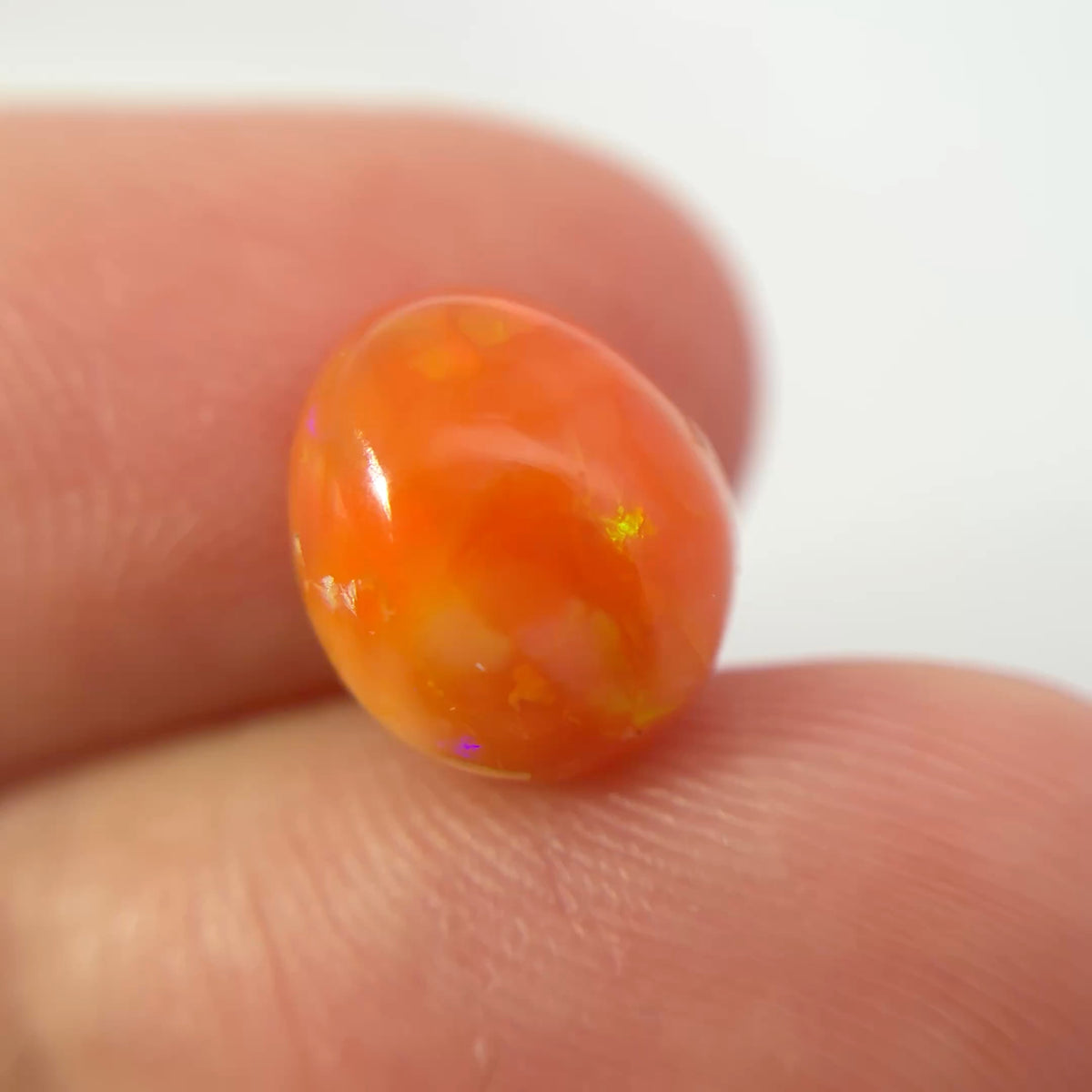 3.16 carat Orange Opal 10.8x9.2mm Oval Cabochon