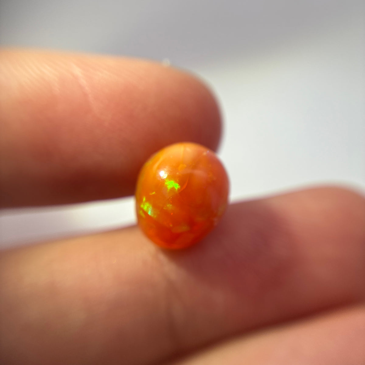 3.16 carat Orange Opal 10.8x9.2mm Oval Cabochon