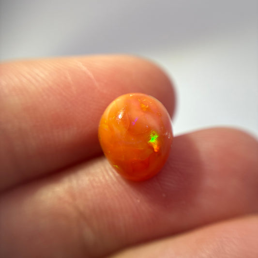 3.16 carat Orange Opal 10.8x9.2mm Oval Cabochon
