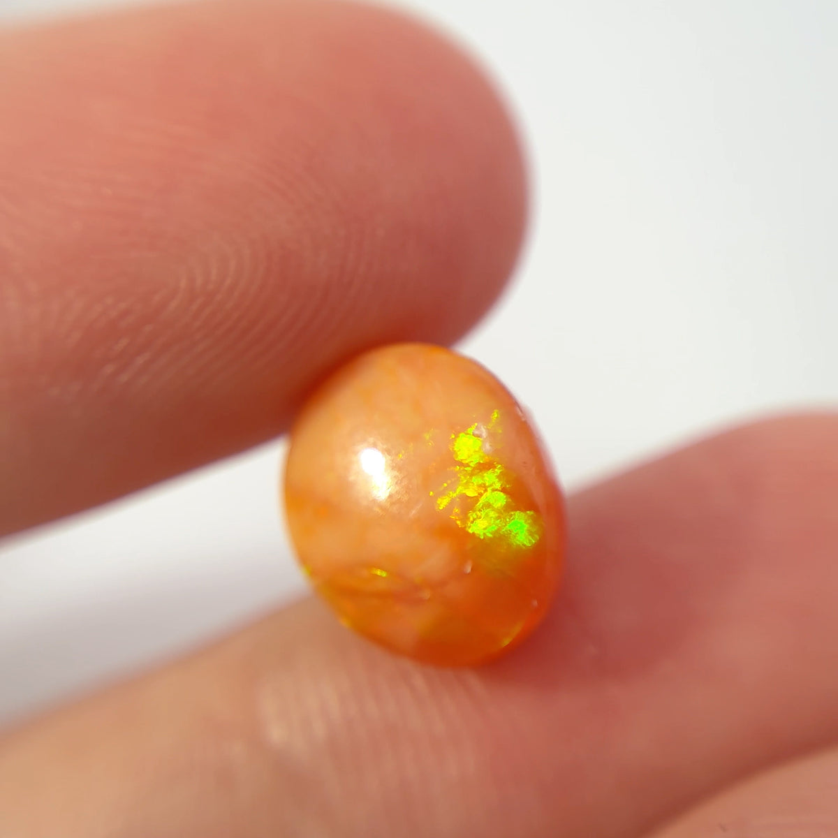 3.16 carat Orange Opal 10.8x9.2mm Oval Cabochon