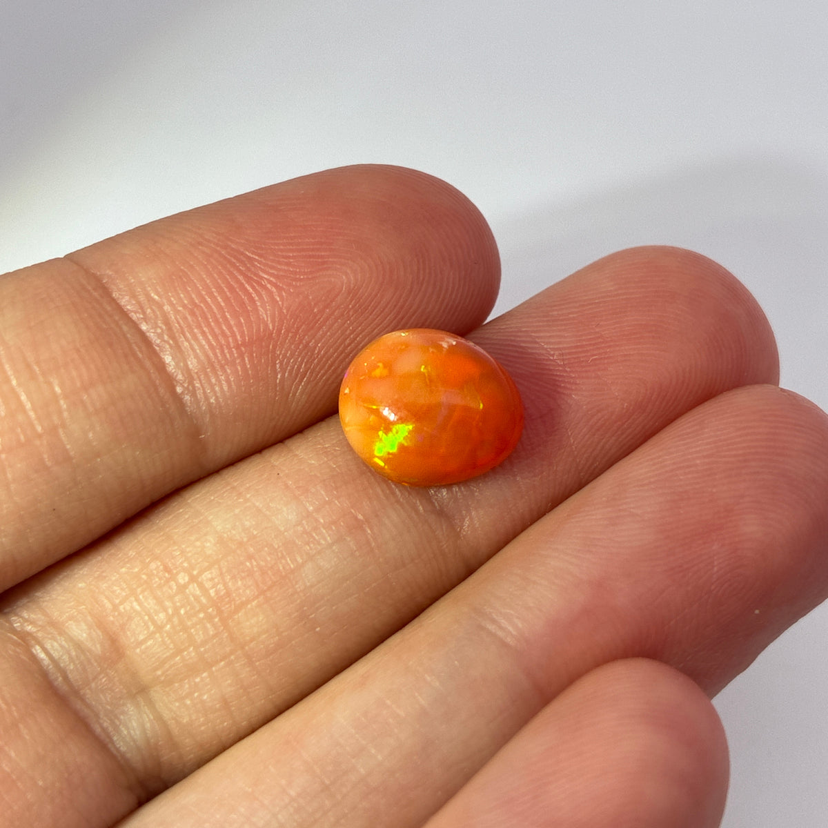 3.16 carat Orange Opal 10.8x9.2mm Oval Cabochon