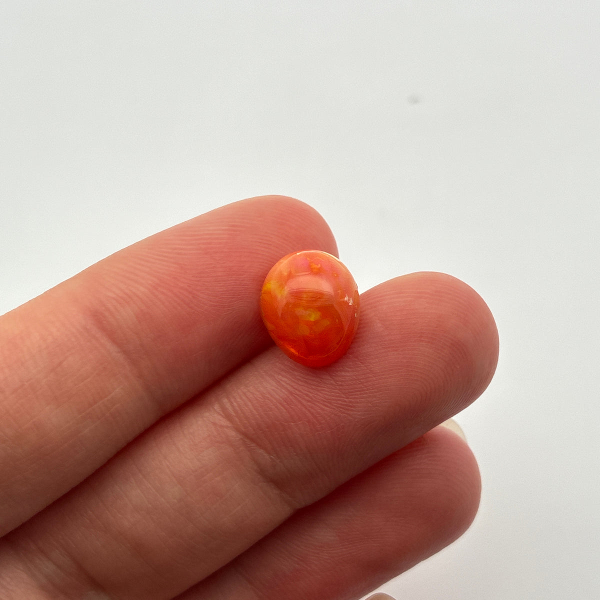 3.16 carat Orange Opal 10.8x9.2mm Oval Cabochon