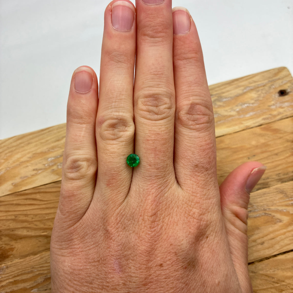 5.4mm Round Cut Green Emerald, 0.63 carat Natural Gem