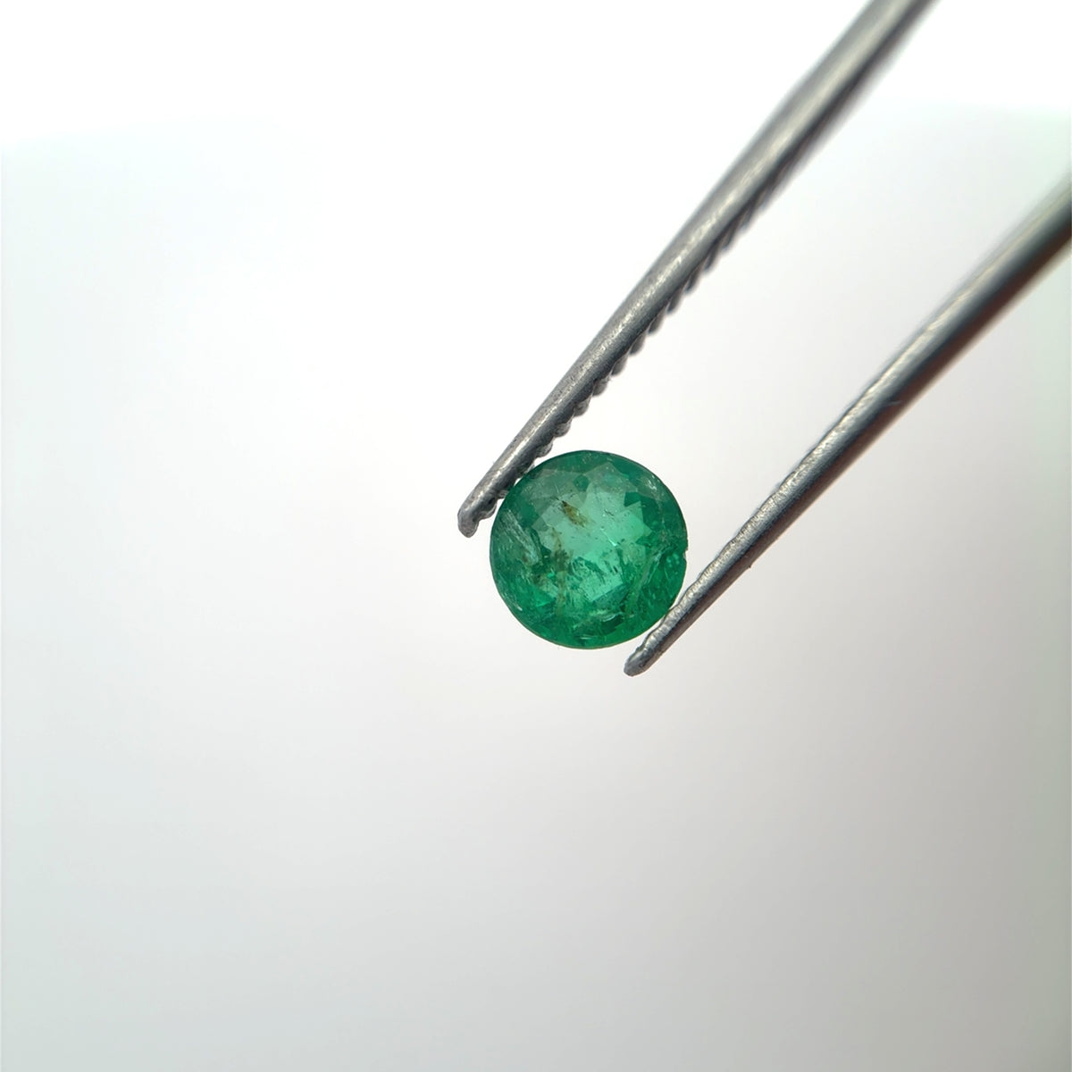 5.4mm Round Cut Green Emerald, 0.63 carat Natural Gem