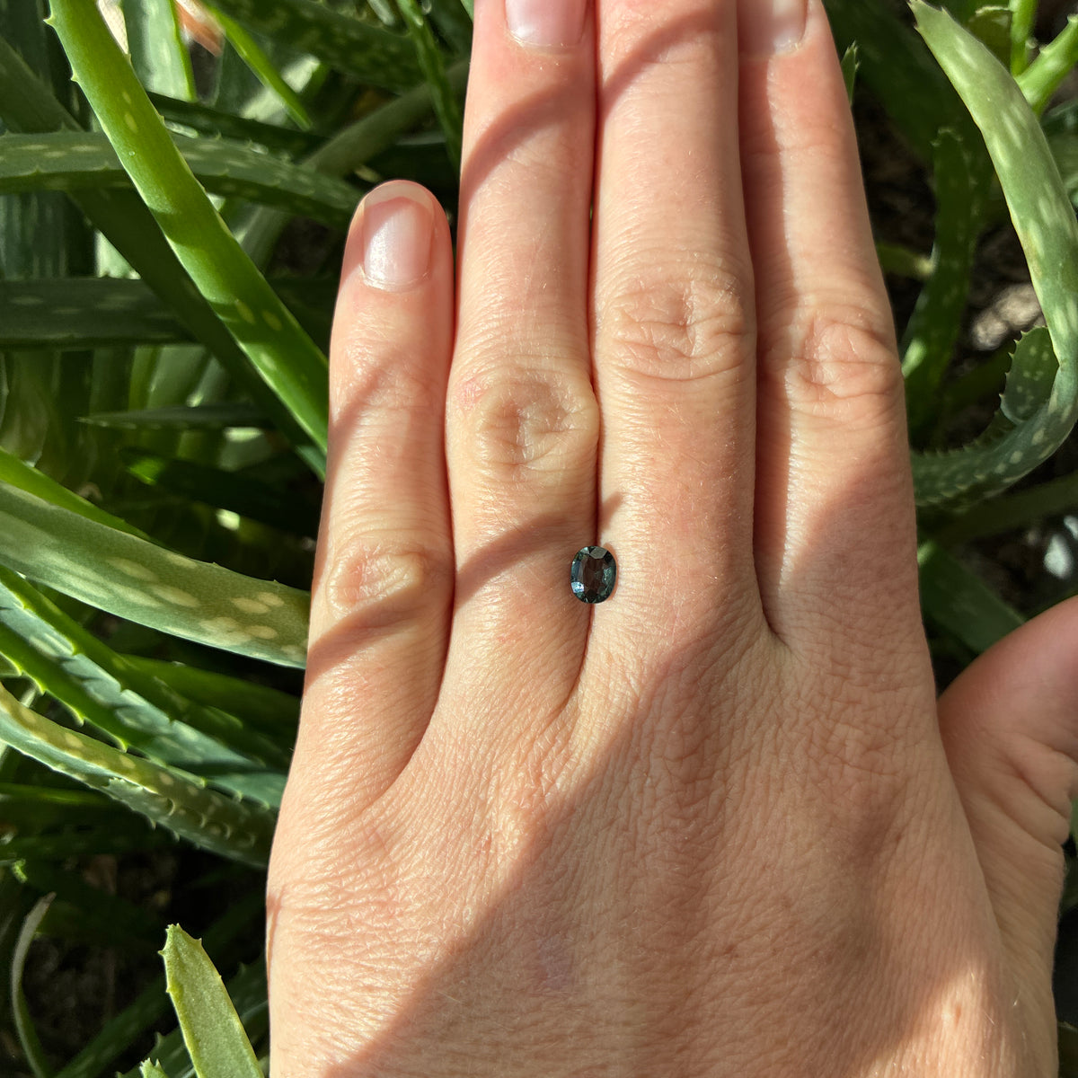 0.64 carat Greenish Blue Spinel, 6x4.8mm Oval cut