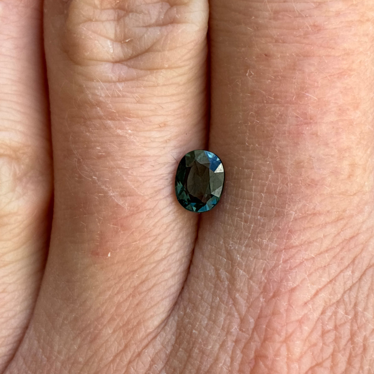 0.64 carat Greenish Blue Spinel, 6x4.8mm Oval cut