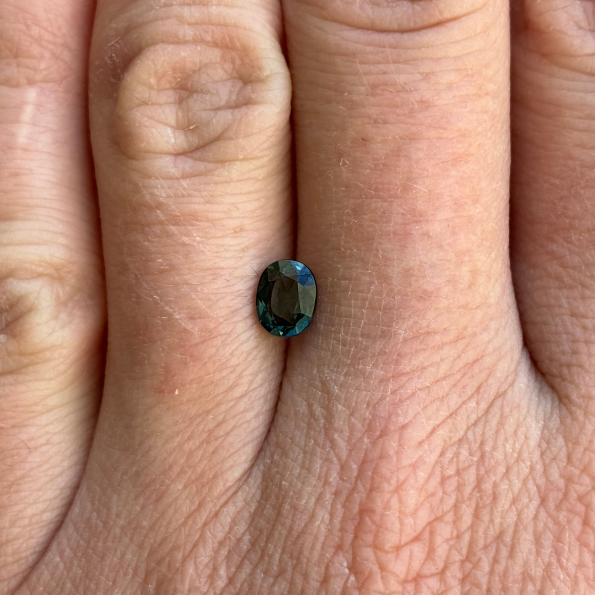 0.64 carat Greenish Blue Spinel, 6x4.8mm Oval cut