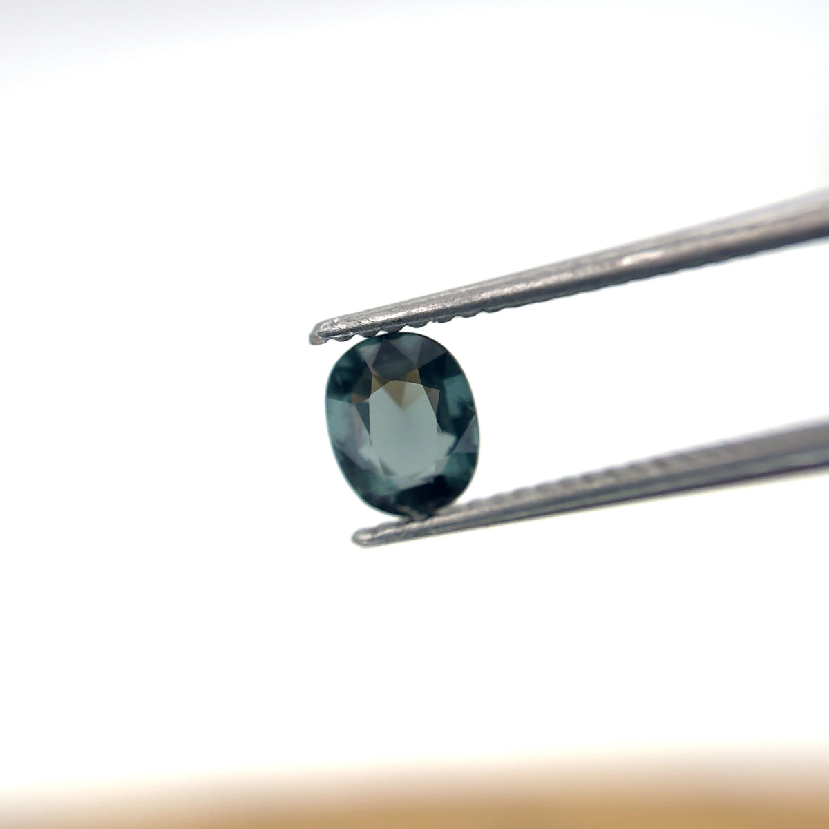 0.64 carat Greenish Blue Spinel, 6x4.8mm Oval cut