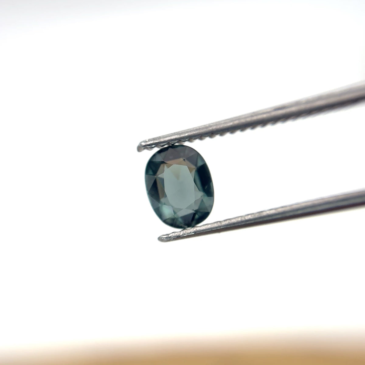 0.64 carat Greenish Blue Spinel, 6x4.8mm Oval cut