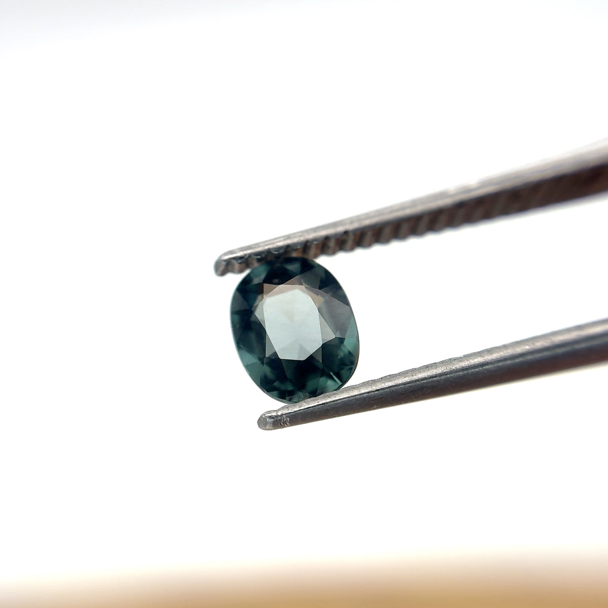 0.64 carat Greenish Blue Spinel, 6x4.8mm Oval cut