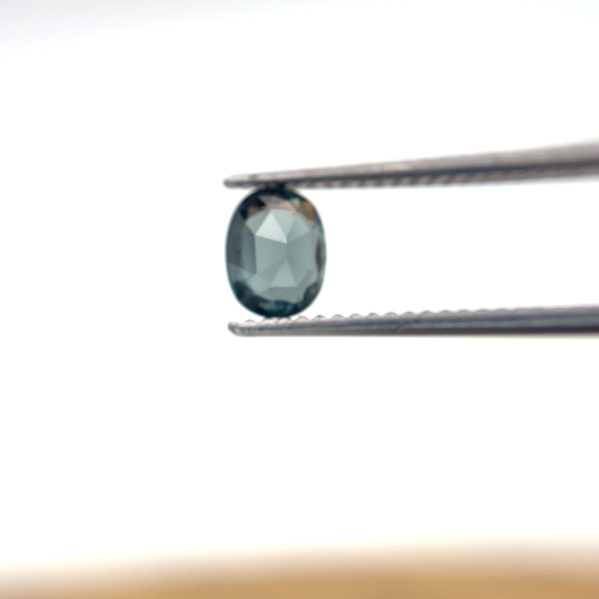 0.64 carat Greenish Blue Spinel, 6x4.8mm Oval cut