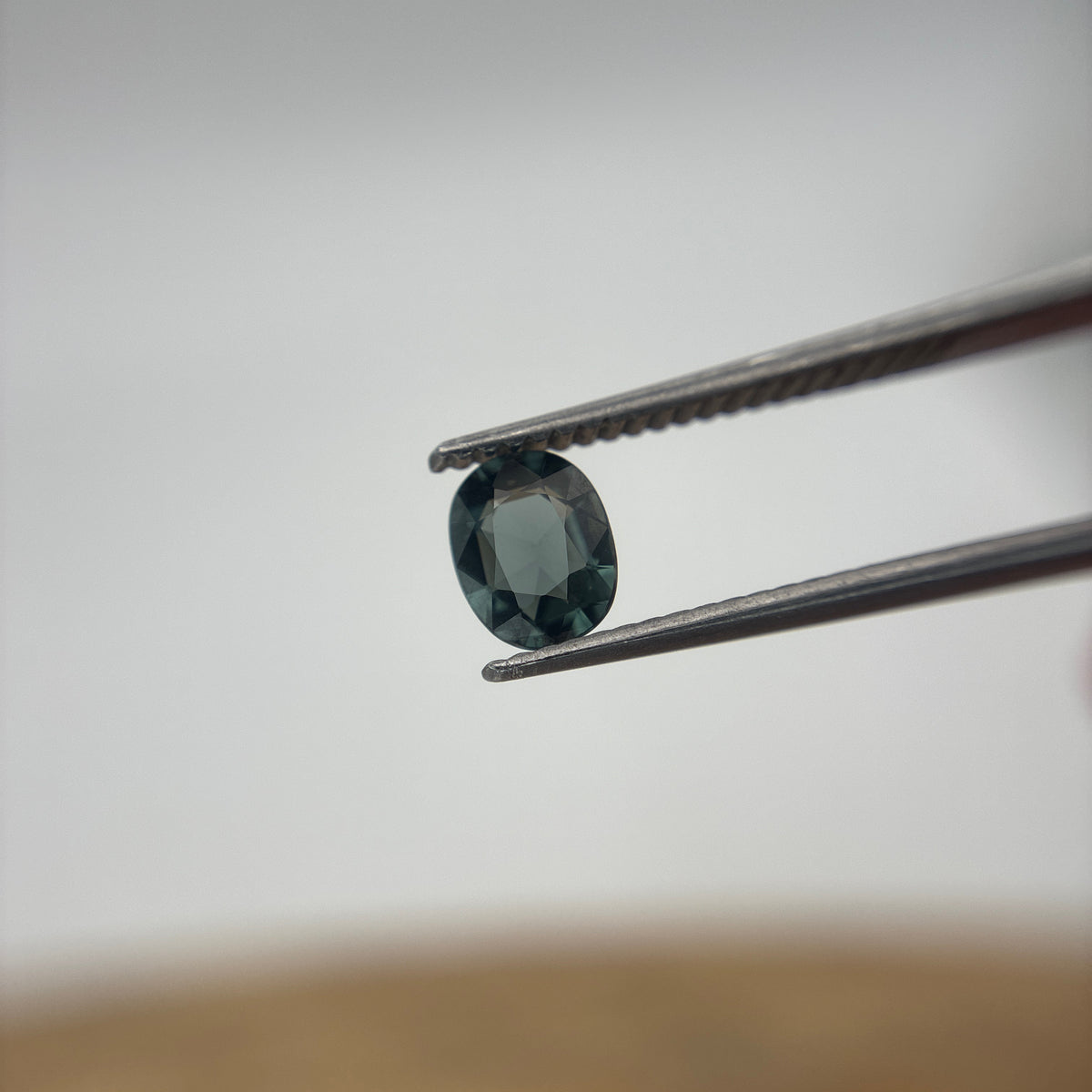 0.64 carat Greenish Blue Spinel, 6x4.8mm Oval cut
