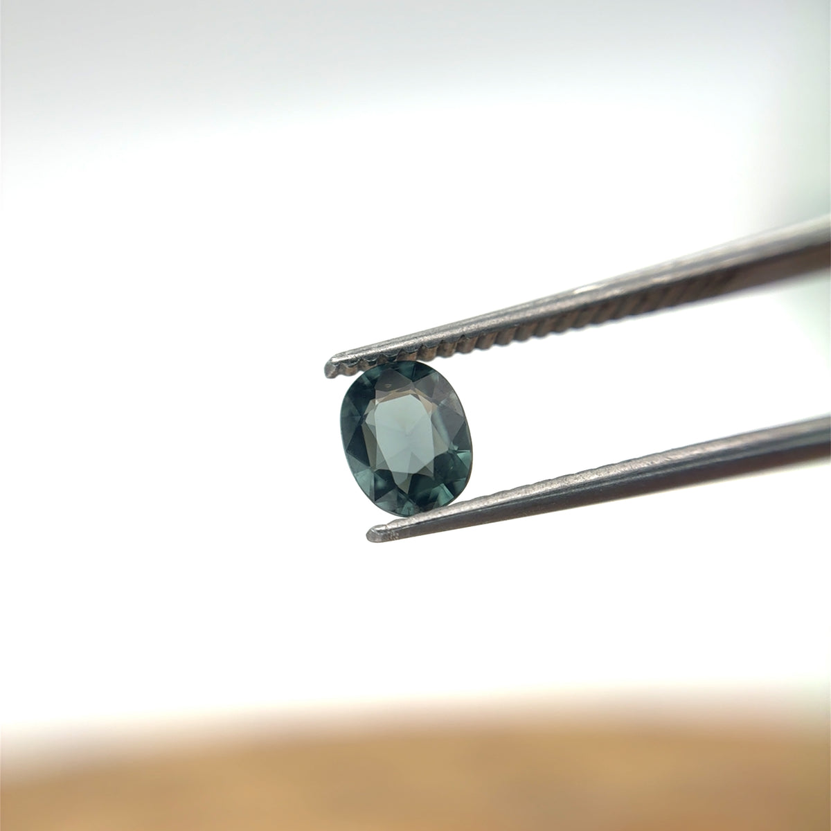 0.64 carat Greenish Blue Spinel, 6x4.8mm Oval cut
