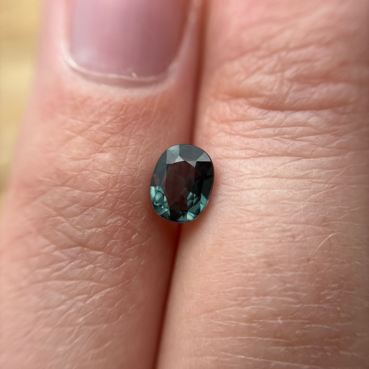 0.64 carat Greenish Blue Spinel, 6x4.8mm Oval cut