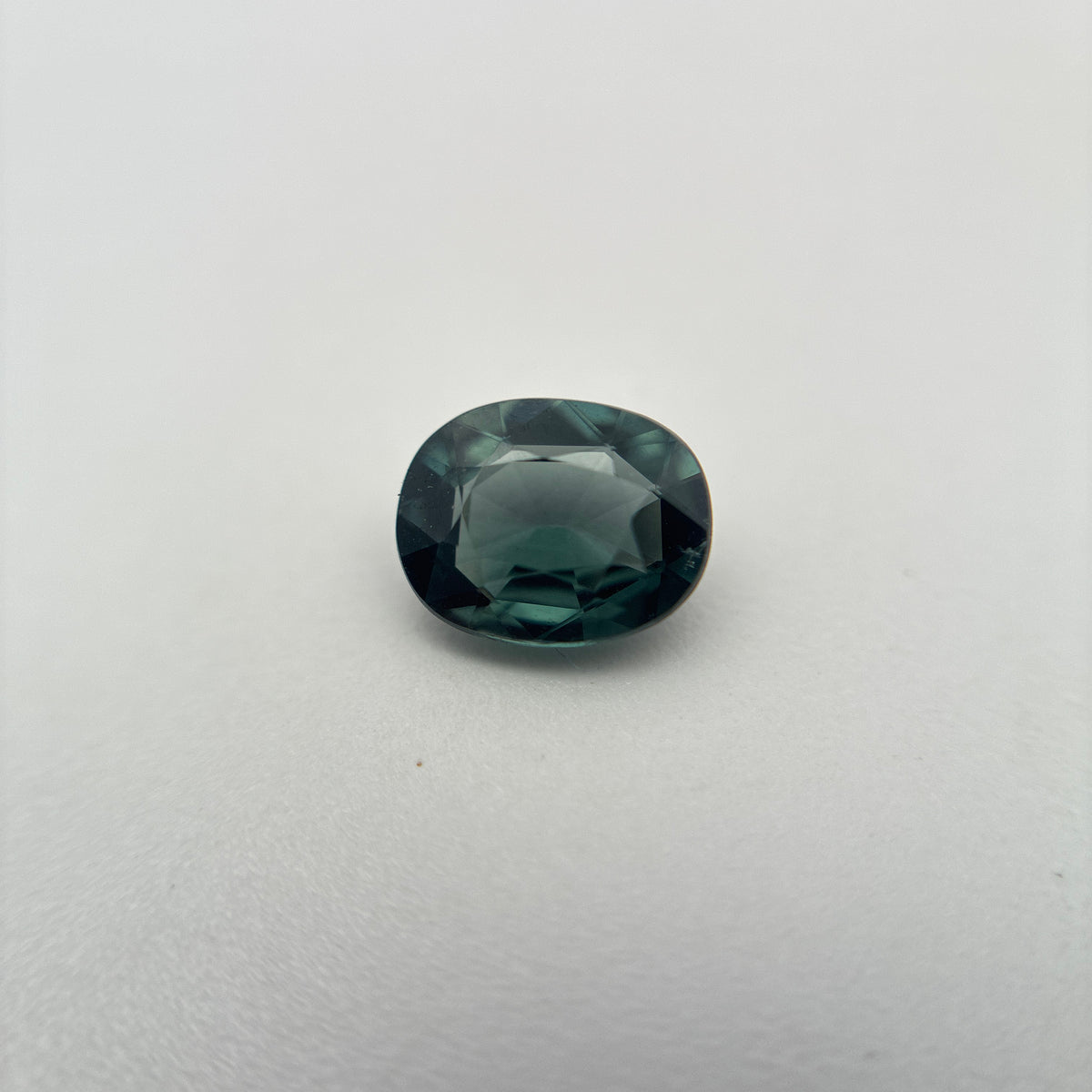 0.64 carat Greenish Blue Spinel, 6x4.8mm Oval cut
