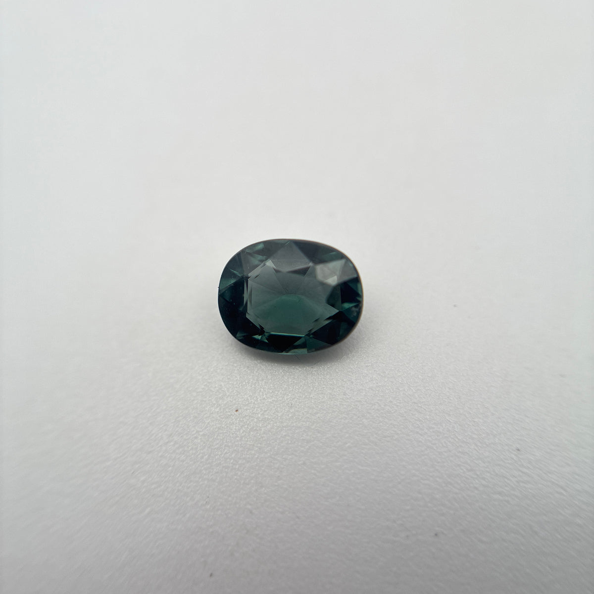 0.64 carat Greenish Blue Spinel, 6x4.8mm Oval cut