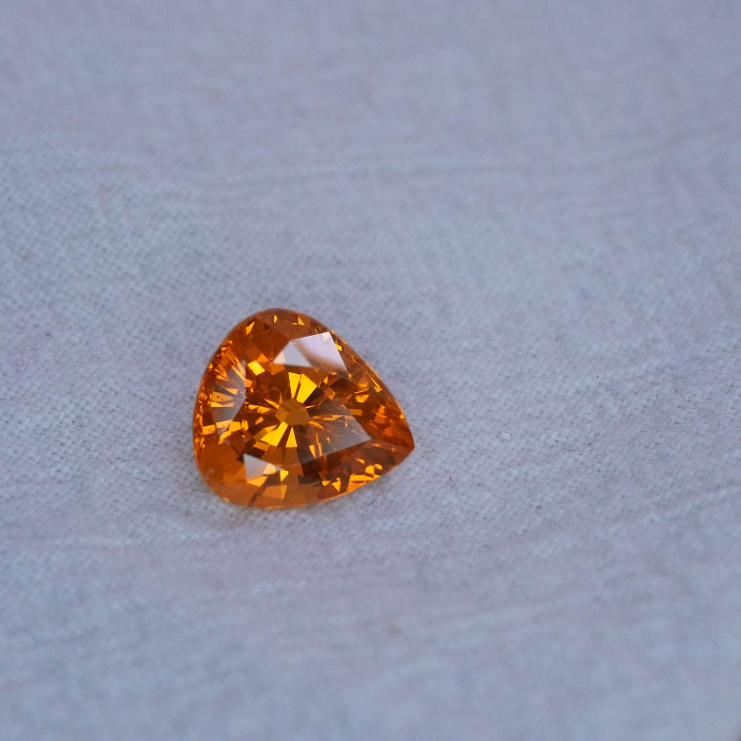 4.22 carat Sapphire 10.45x9.25mm Pear Cut, Orange Yellow, BE Treated