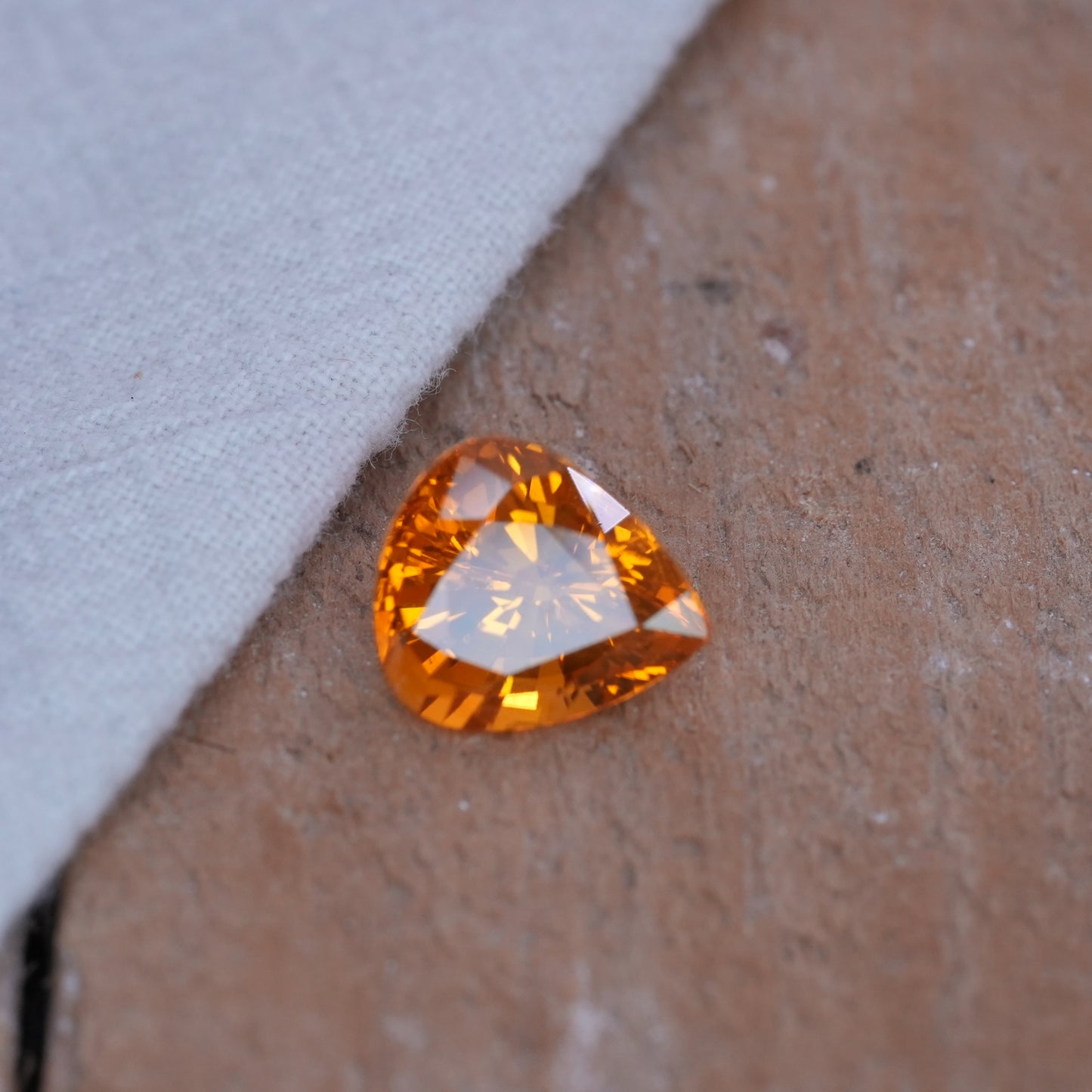 4.22 carat Sapphire 10.45x9.25mm Pear Cut, Orange Yellow, BE Treated