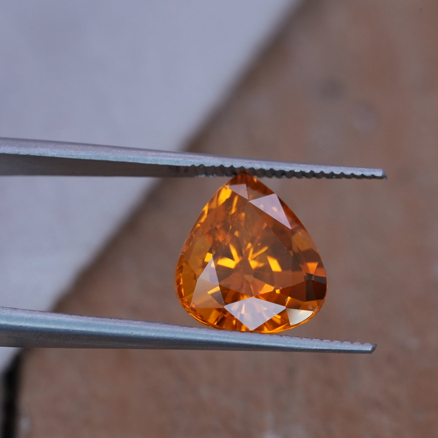 4.22 carat Sapphire 10.45x9.25mm Pear Cut, Orange Yellow, BE Treated