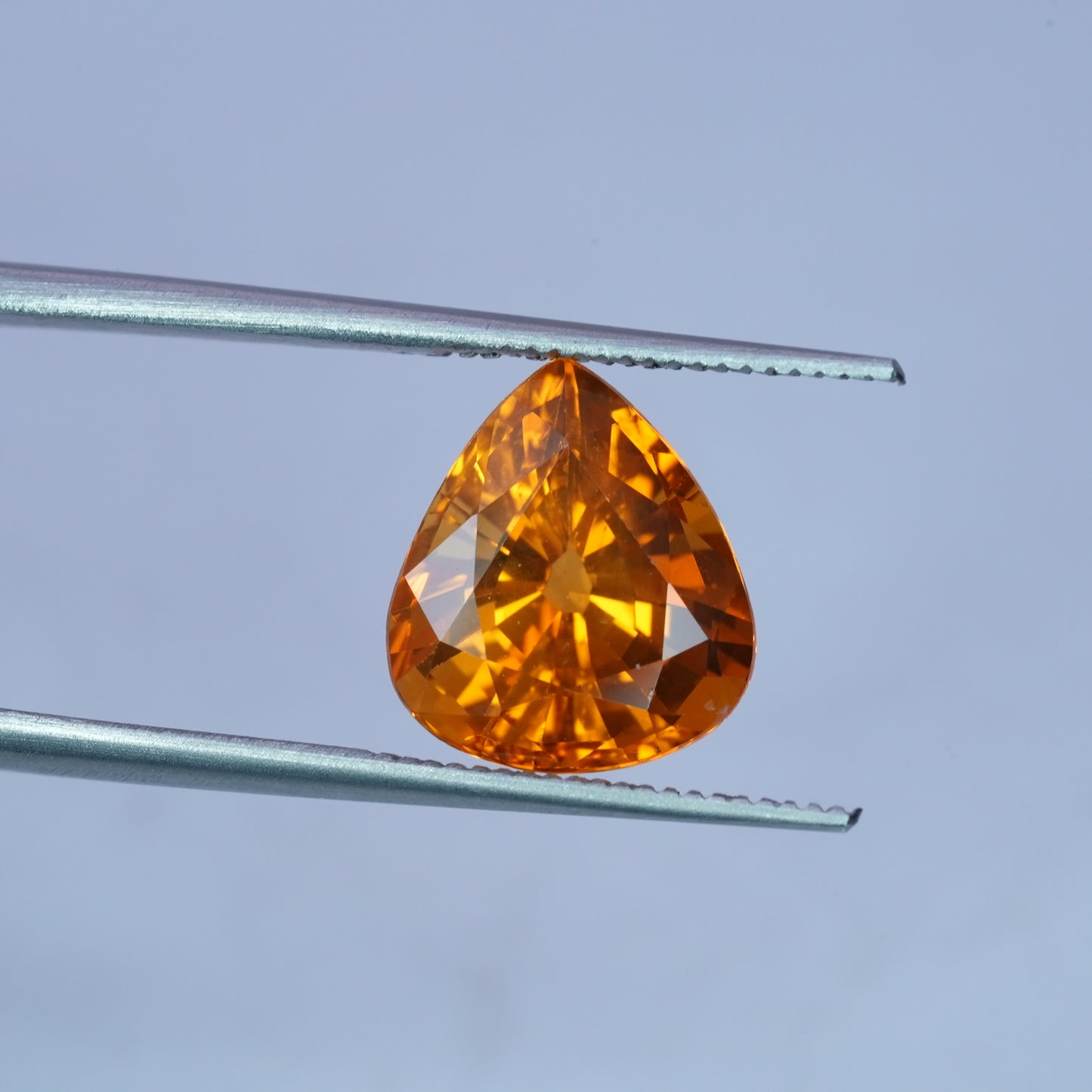 4.22 carat Sapphire 10.45x9.25mm Pear Cut, Orange Yellow, BE Treated