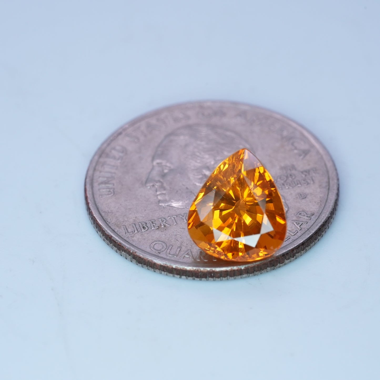 4.22 carat Sapphire 10.45x9.25mm Pear Cut, Orange Yellow, BE Treated
