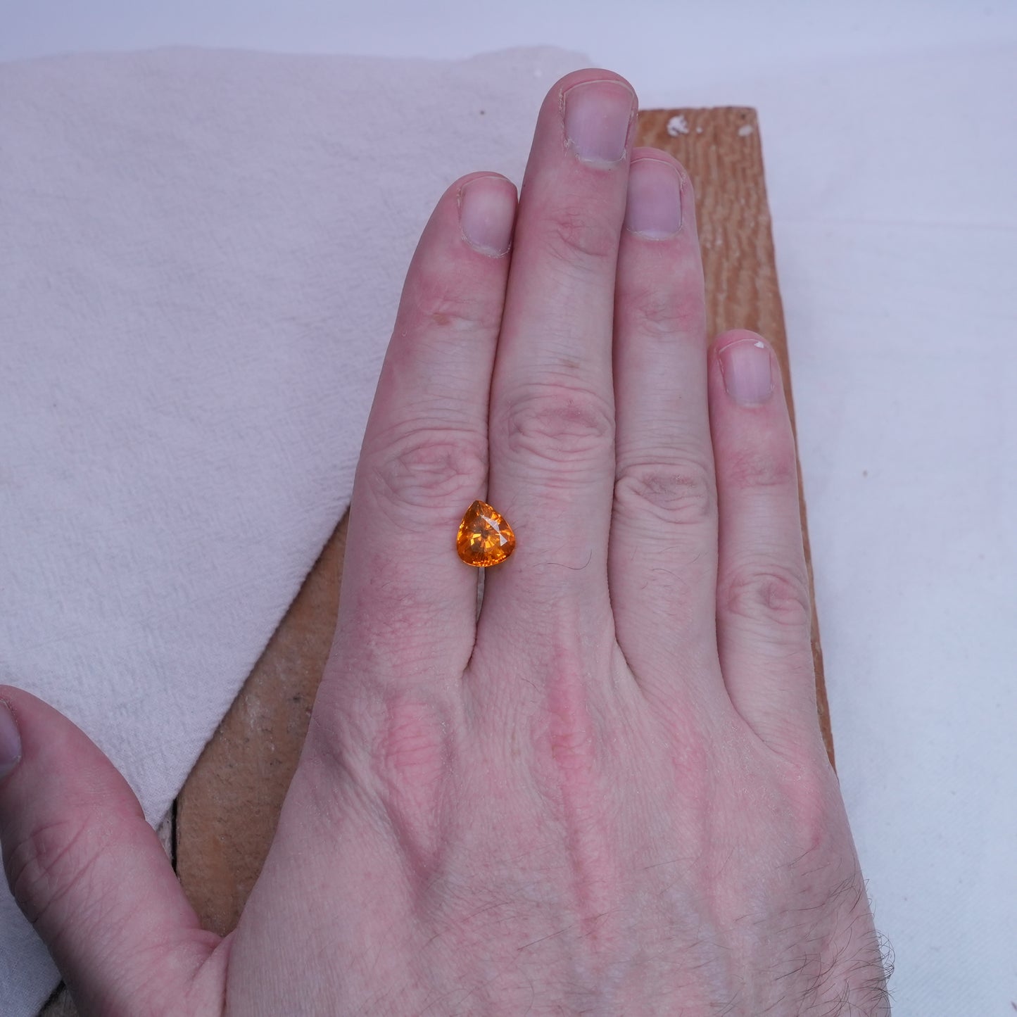 4.22 carat Sapphire 10.45x9.25mm Pear Cut, Orange Yellow, BE Treated