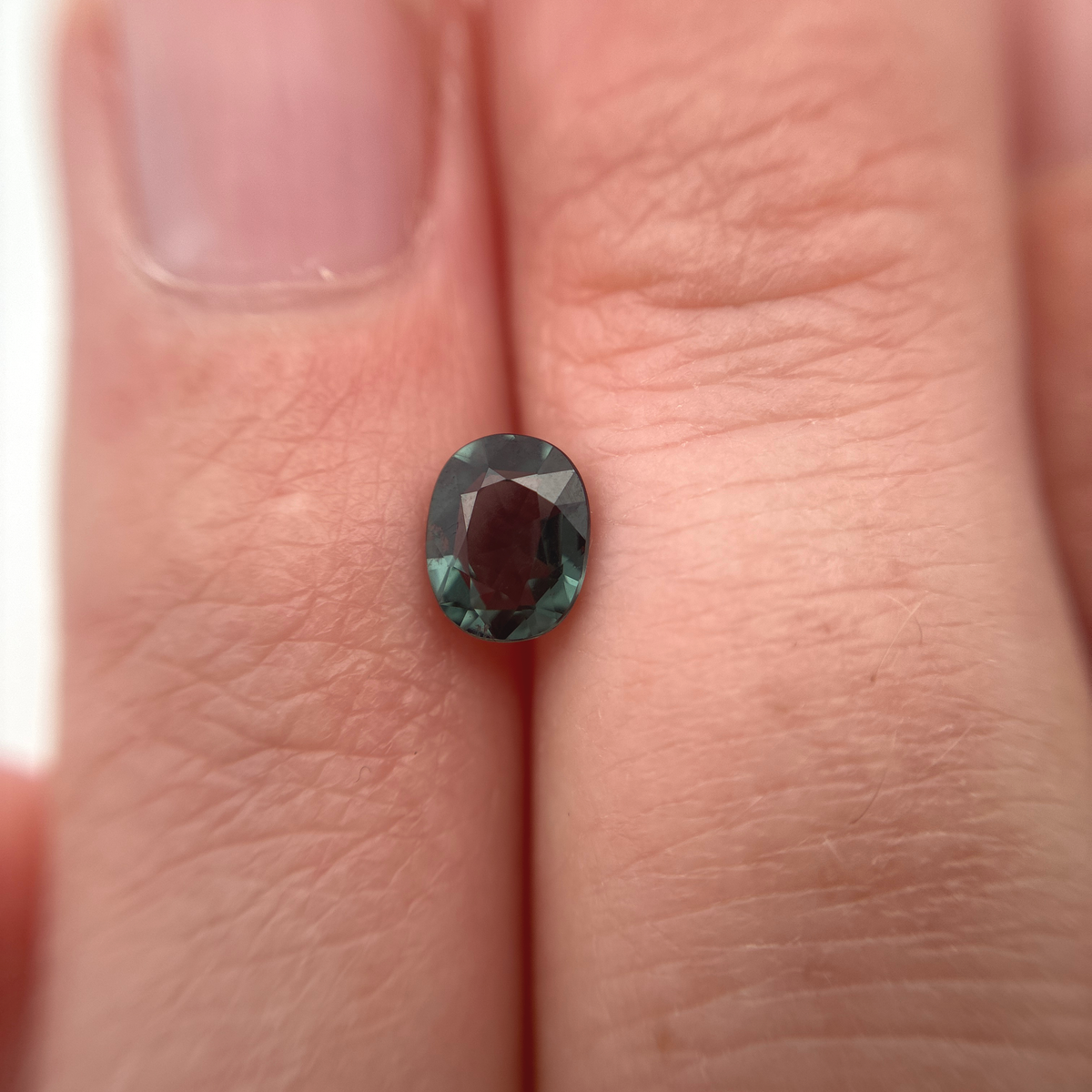 0.64 carat Greenish Blue Spinel, 6x4.8mm Oval cut