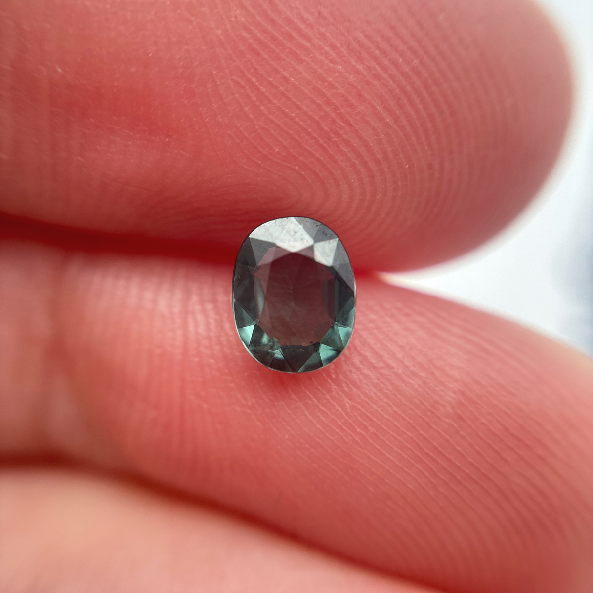 0.64 carat Greenish Blue Spinel, 6x4.8mm Oval cut