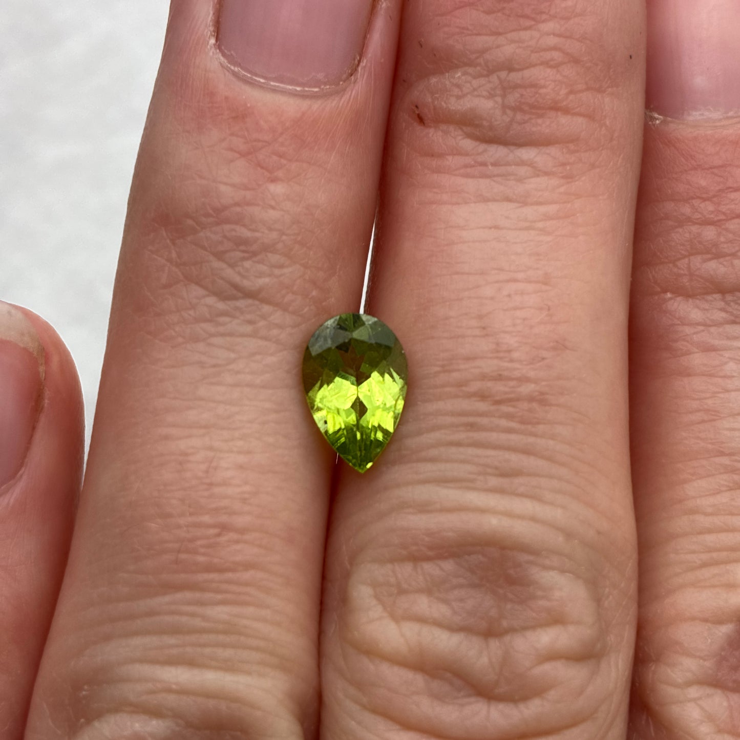 One 8x6mm Green Peridot Pear Cut 1 carat