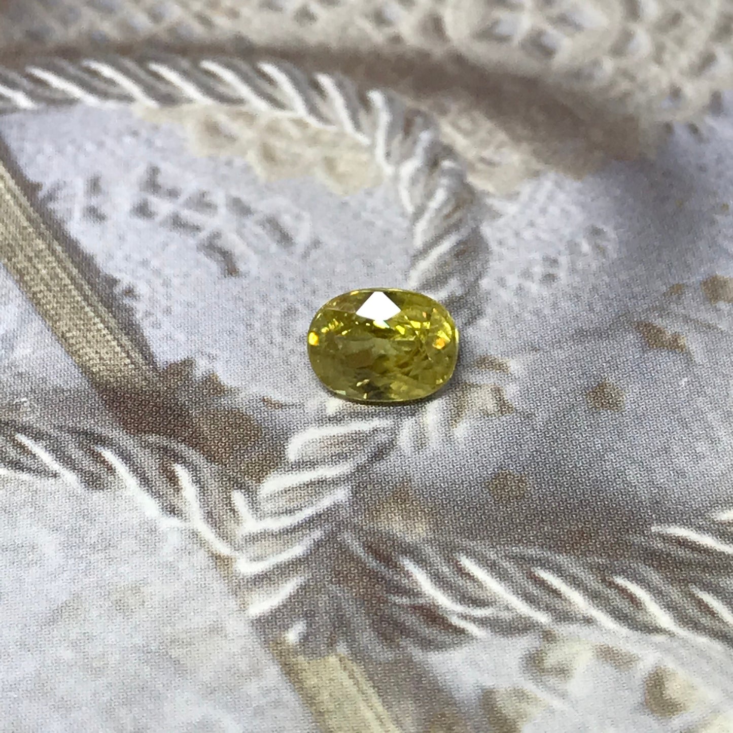 Yellow Sphene 1.23 Carat 6.8x5.2mm Oval Cut, Natural loose wholesale gemstone