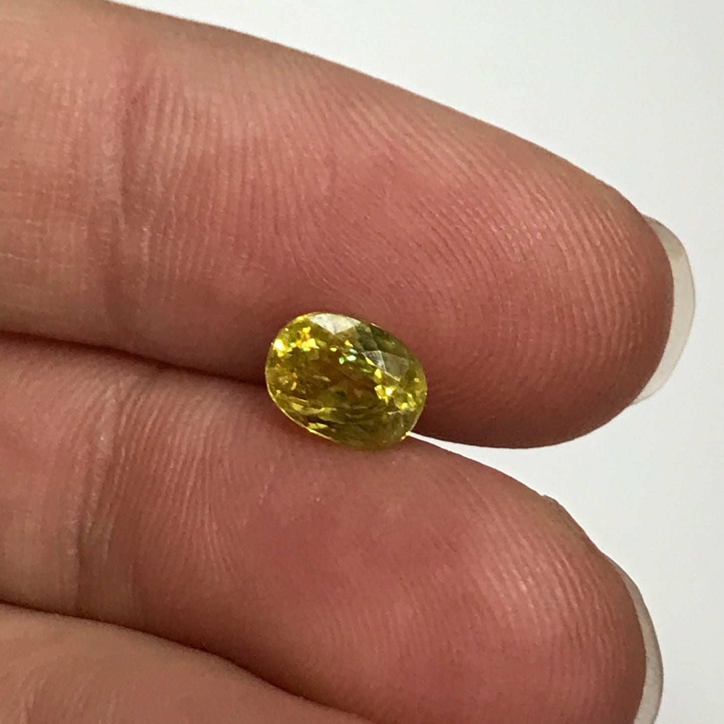 Yellow Sphene 1.23 Carat 6.8x5.2mm Oval Cut, Natural loose wholesale gemstone