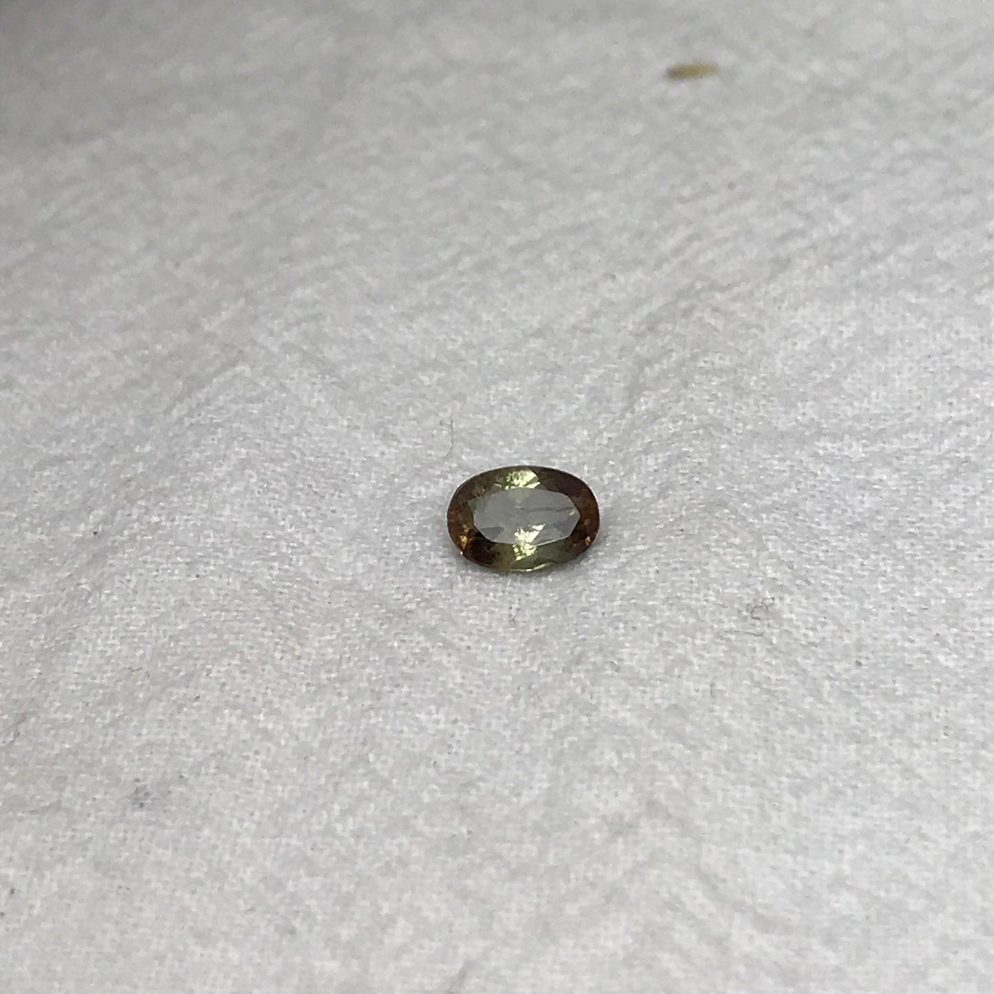 Andalusite 0.72 carat 7x5mm Oval Cut, Faceted Loose Unmounted Gemstone, Green Brown Pleochroism Bicolor Gemstone