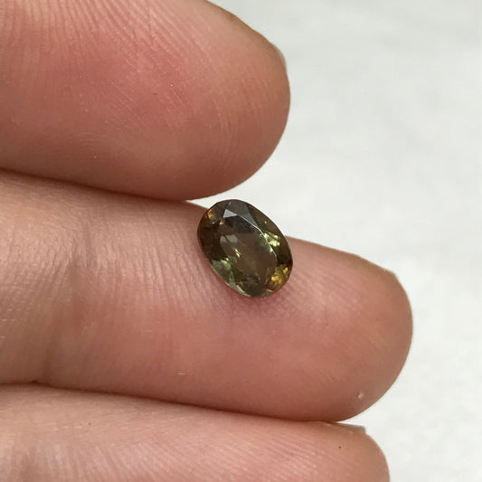 Andalusite 0.72 carat 7x5mm Oval Cut, Faceted Loose Unmounted Gemstone, Green Brown Pleochroism Bicolor Gemstone
