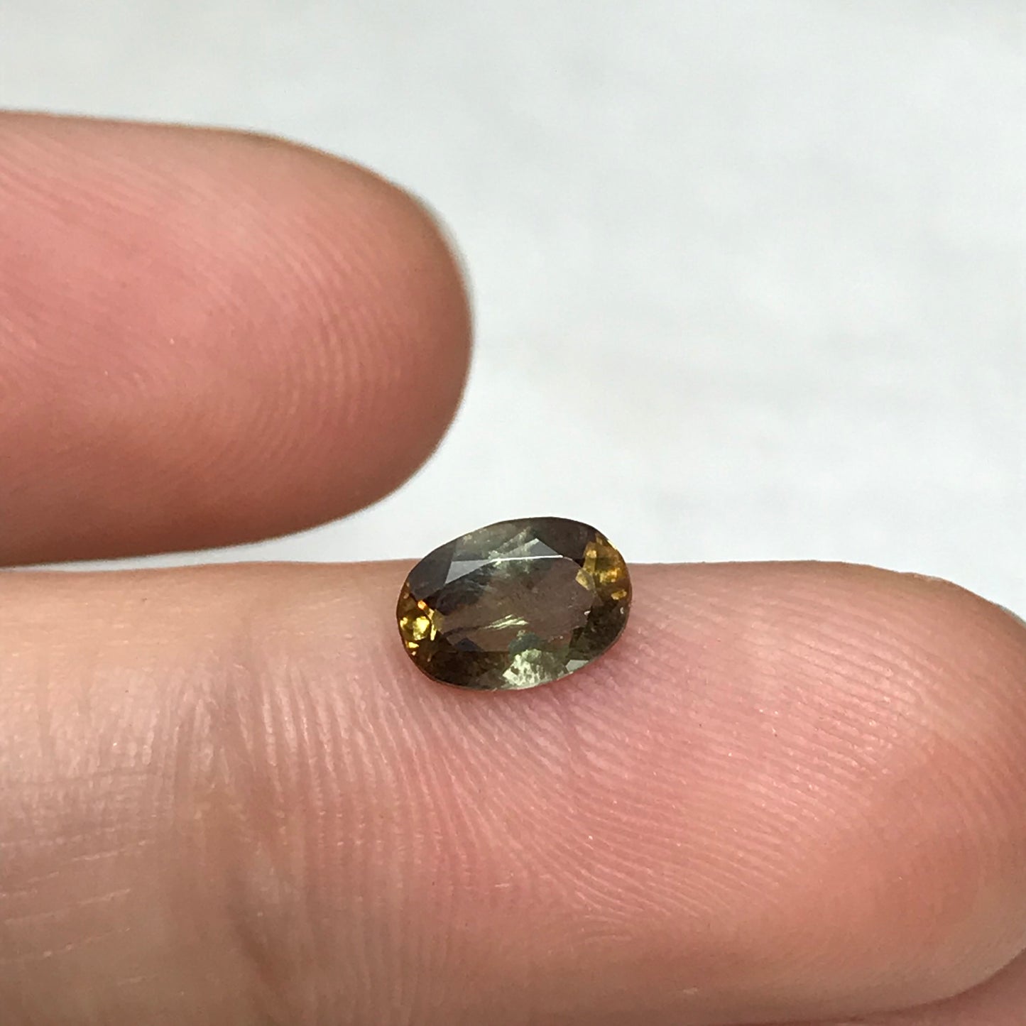 Andalusite 0.72 carat 7x5mm Oval Cut, Faceted Loose Unmounted Gemstone, Green Brown Pleochroism Bicolor Gemstone