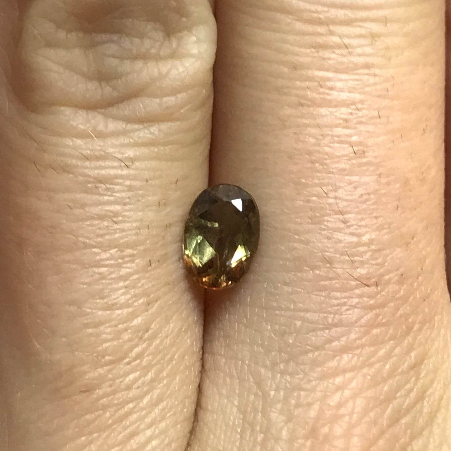 Andalusite 0.72 carat 7x5mm Oval Cut, Faceted Loose Unmounted Gemstone, Green Brown Pleochroism Bicolor Gemstone