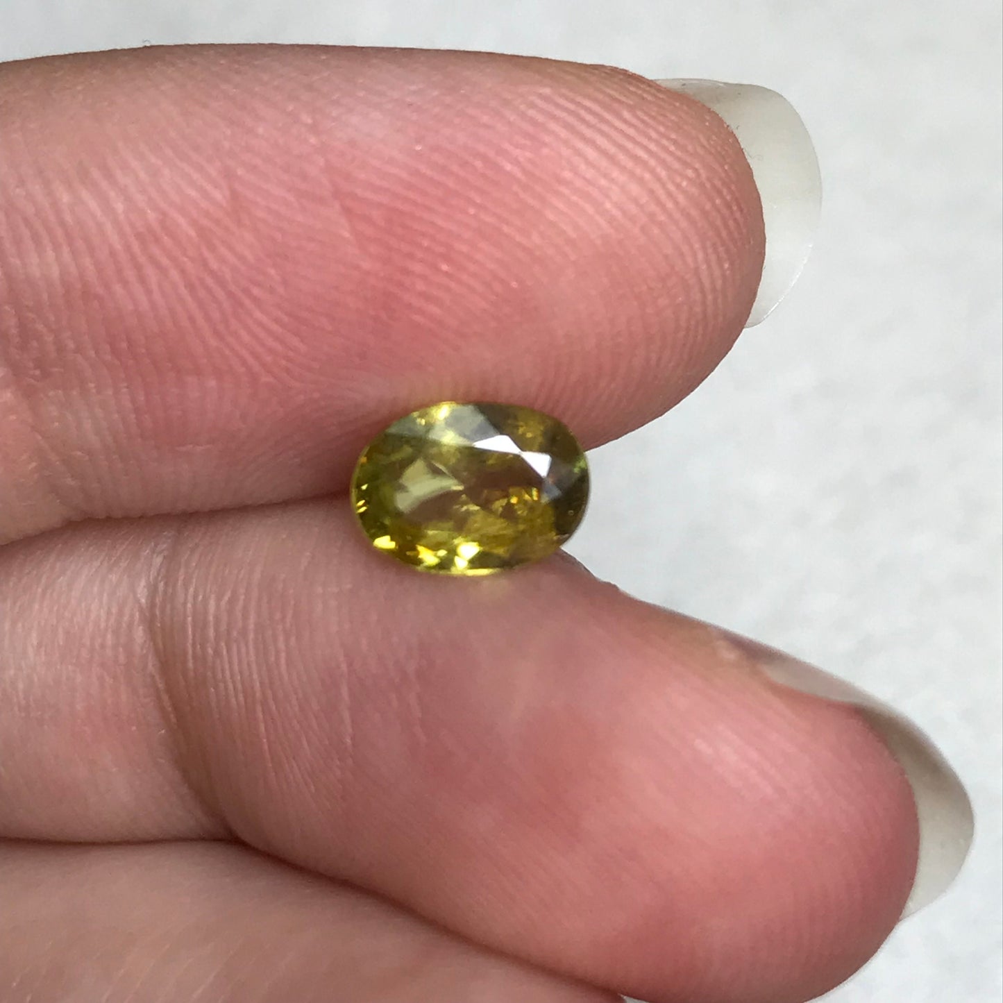0.96 ct Yellow Sphene 7.5x5.5mm Oval Cut, Natural Untreated from Madagascar, 1 carat Greenish Yellow Sphene with Rainbow Flashes