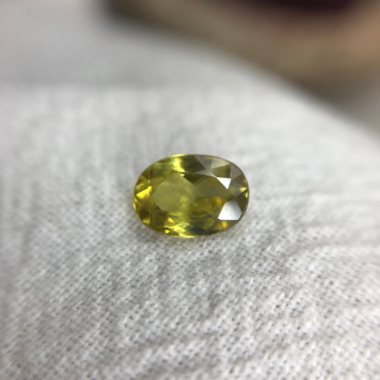 0.96 ct Yellow Sphene 7.5x5.5mm Oval Cut, Natural Untreated from Madagascar, 1 carat Greenish Yellow Sphene with Rainbow Flashes