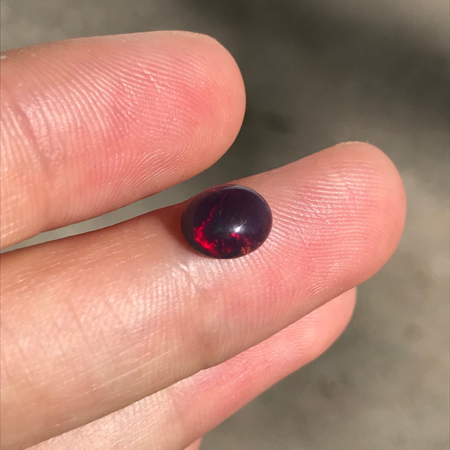 Black Opal 0.98 carat 8x6.5mm Oval Cabochon, Green Orange & Yellow Play of Color, Smoke Enhanced Natural Opal