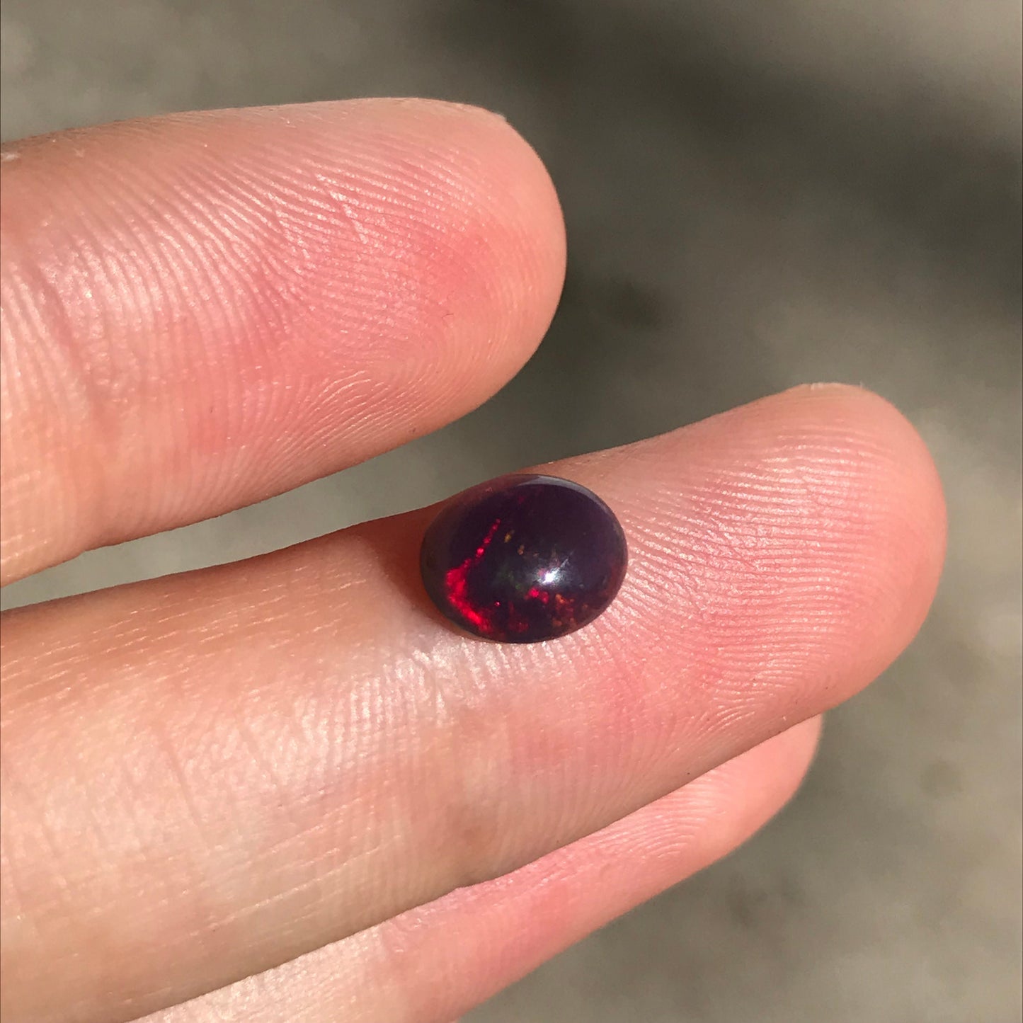 Black Opal 0.98 carat 8x6.5mm Oval Cabochon, Green Orange & Yellow Play of Color, Smoke Enhanced Natural Opal