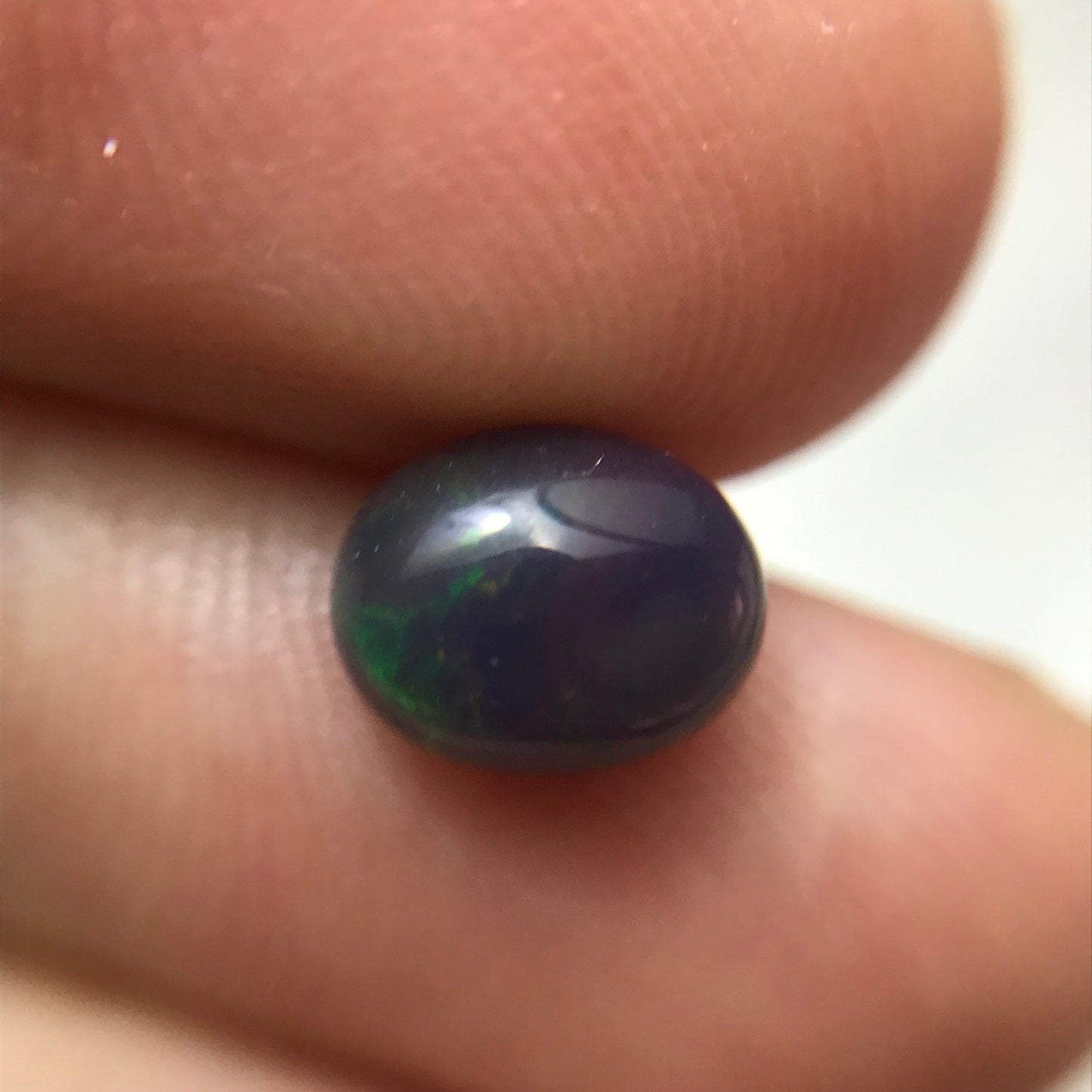 Black Opal 0.98 carat 8x6.5mm Oval Cabochon, Green Orange & Yellow Play of Color, Smoke Enhanced Natural Opal